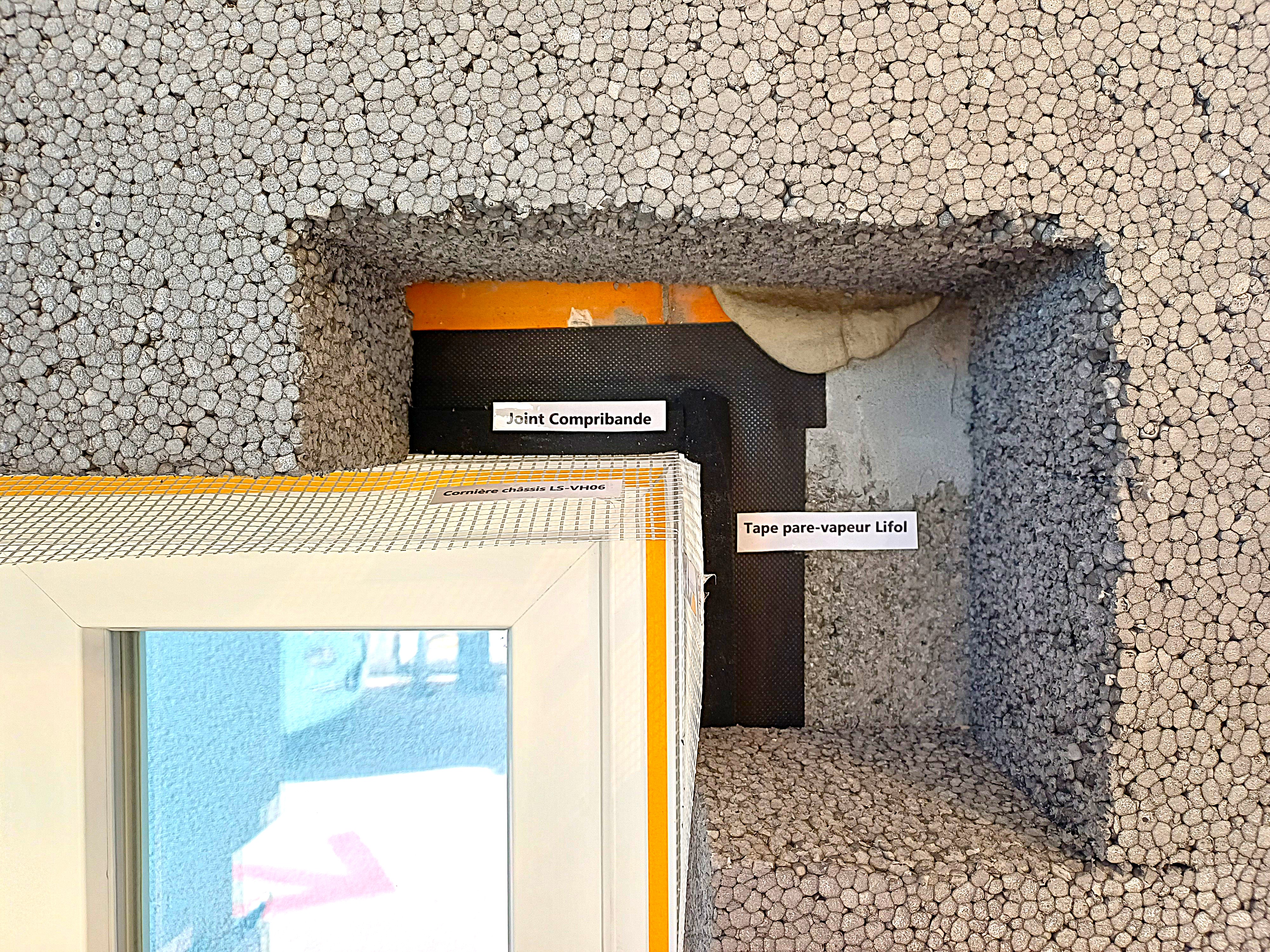 Installation of Compribande seals against the LS-VH06 frame corner brackets and on the vapor barrier joints